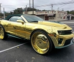 Gold Soaked King zl1 Camaro Rides on 30 inch Gilded Wheels with three 23 Inch TvsK