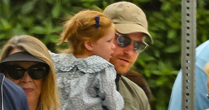  Prince Harry cradles Princess Lilibet during Fourth of July outing with Meghan Markle
